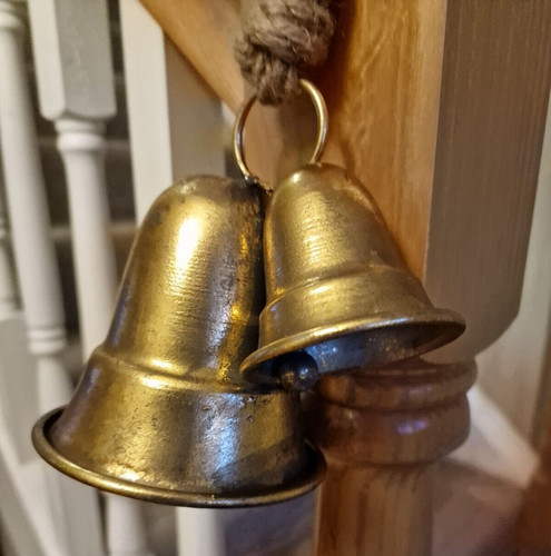 Pair gold metal bells - of,